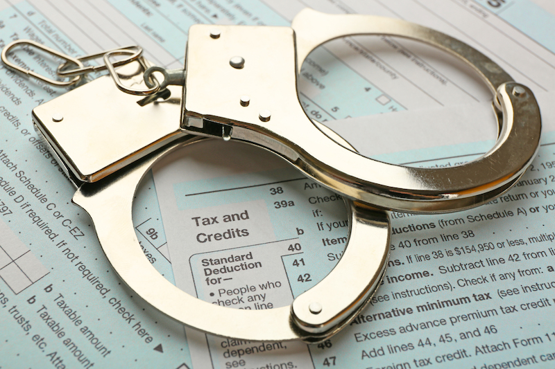 handcuffs-income-tax-return-form-background.jpg
